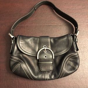 Women’s black leather coach bag